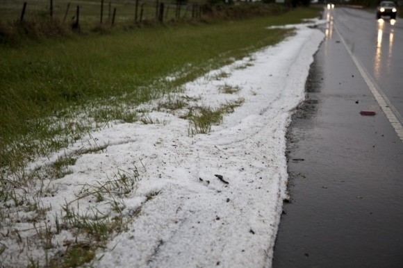 hail swept into drifts onto the road side