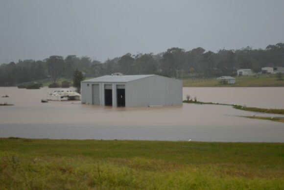 Rising flood waters and flooded properties. Flooded low lying areas