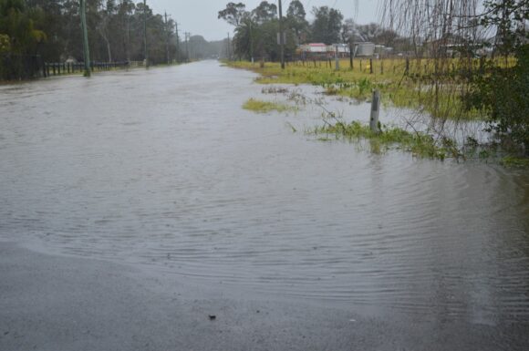 Flooding rain and floods impacting roads around Schofields Flooded roads