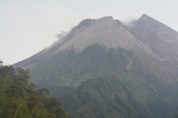 Active volcanoes, storms and volcanic eruptions. Volcanic eruptions and thunderstorms - Gunung Merapi Indonesia July and August 2023.